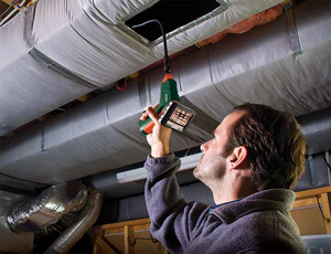 Man Cleaning Air Ducts